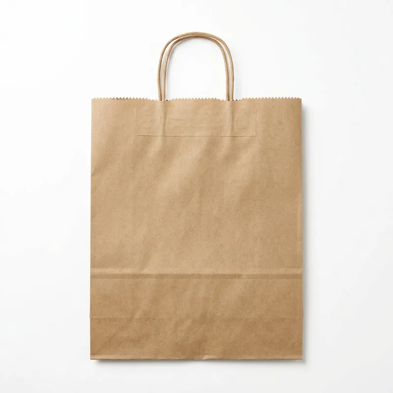 Brown kraft V-bottom paper bag with twisted paper handles, lying flat to show its gusset creases and serrated top edge